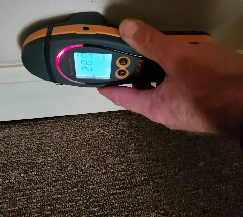 Moisture detection at baseboard during Storm Damage Restoration in Atmore